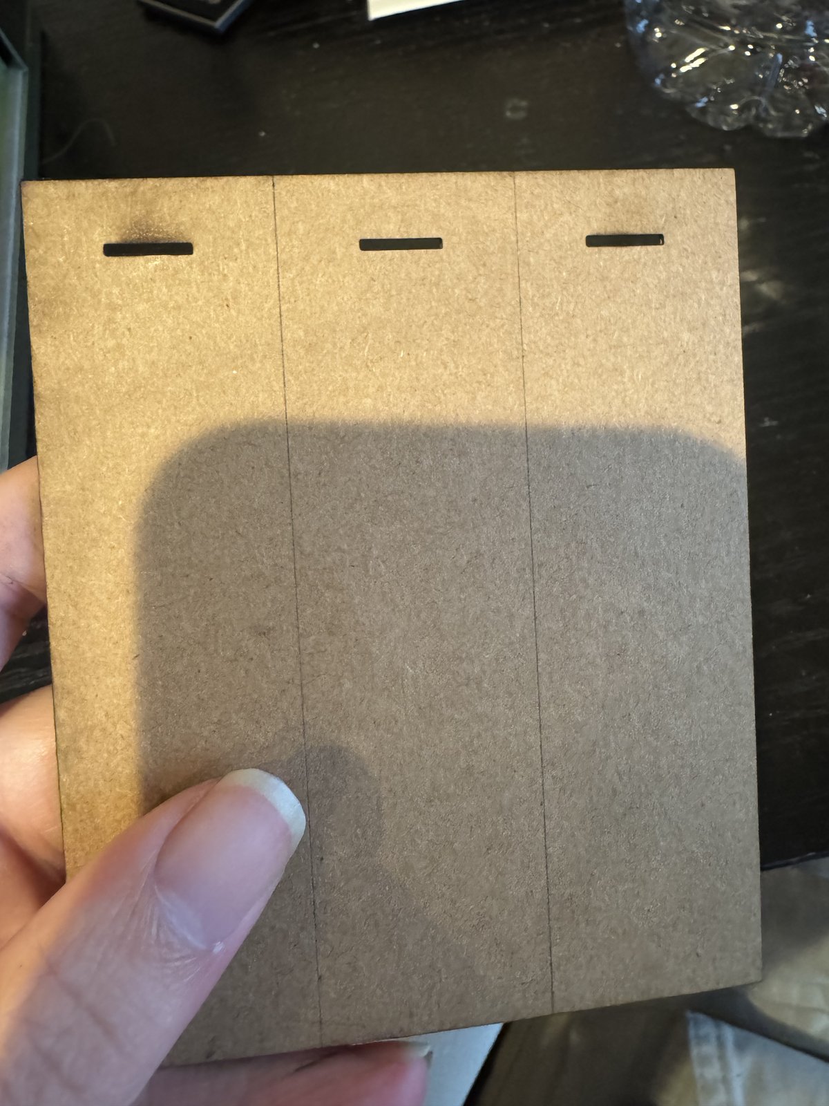 Cardboard material marked for controller assembly